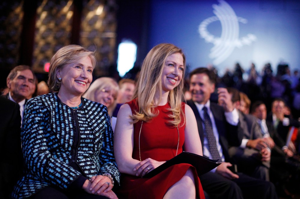 Former Secretary of State Hillary Rodham Clinton, left, and her daughter Chelsea Clinton, center, at the Clinton Global Initiative in New York, Sept. 24, 2013.
