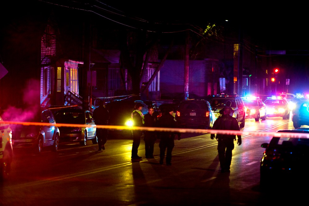 Madison Police investigate the scene of a shooting on Williamson Street on March 6, 2015 in Madison, Wis. (Photo by Steve Apps/Wisconsin State Journal/AP)