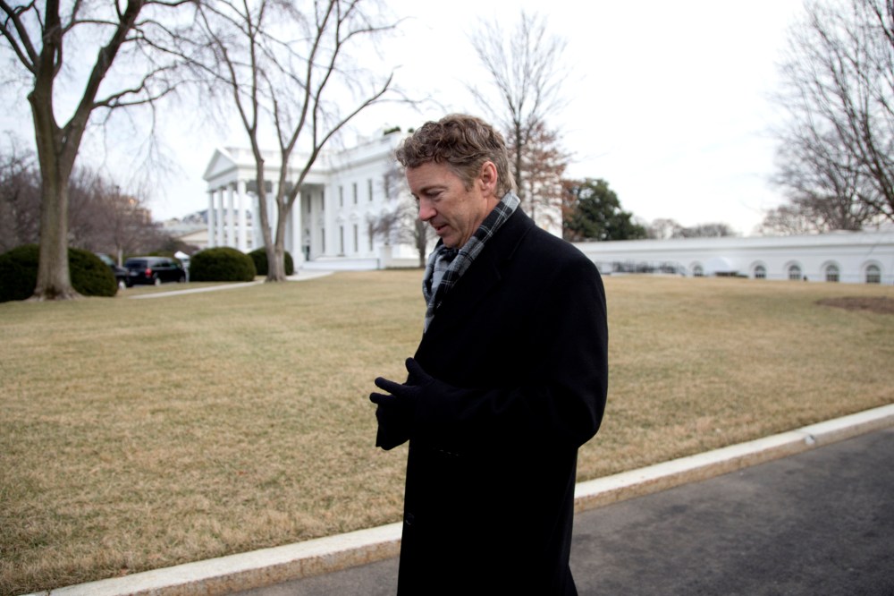 Rand Paul walks from the White House after an event hosted by Barack Obama about the Promise Zones Initiative, Jan. 9, 2014.