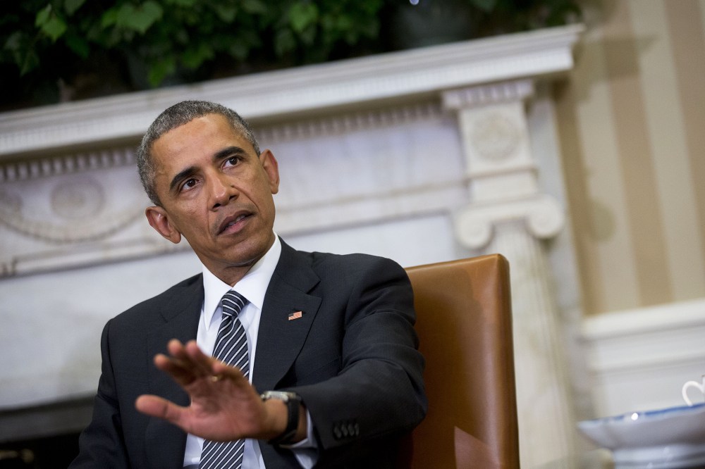 President Obama is seen in the Oval Office on Feb. 17, 2015 in Washington, D.C. (Photo by Rex Features/AP)