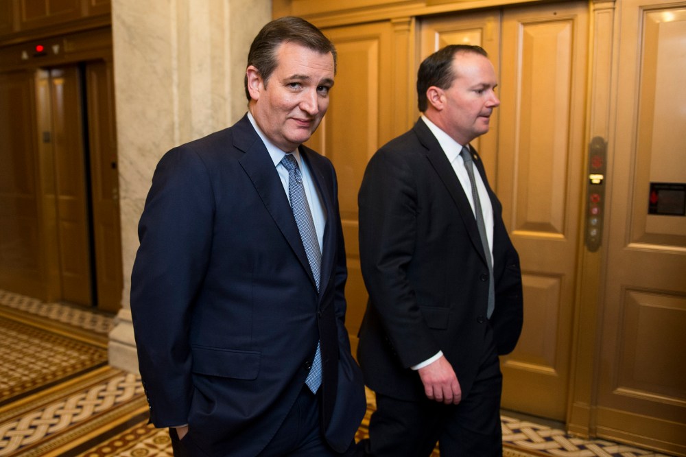 Presidential candidate Sen. Ted Cruz speaks with Sen. Mike Lee, R-Utah, as they leave the Senate floor following the cloture vote on the "American Security Against Foreign Enemies Act of 2015" on Jan. 20, 2016. (Photo By Bill Clark/CQ Roll Call/AP)