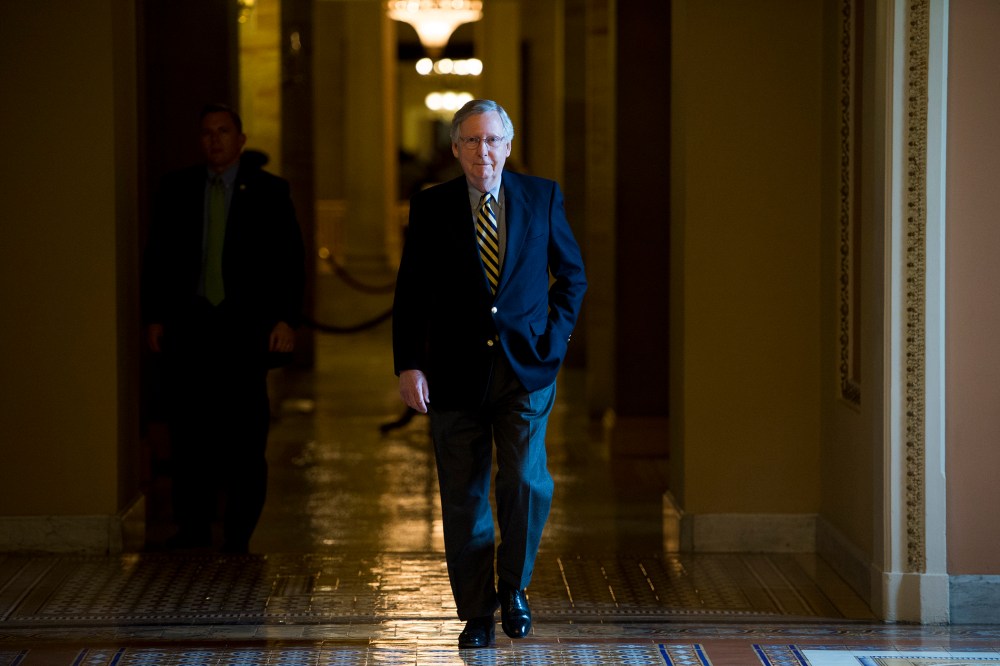 Senate Majority Leader Mitch McConnell, R-Ky., walks to the Senate floor for the votes on funding the Department of Homeland Security on Feb. 27, 2015. (Photo By Bill Clark/CQ Roll Call/AP)