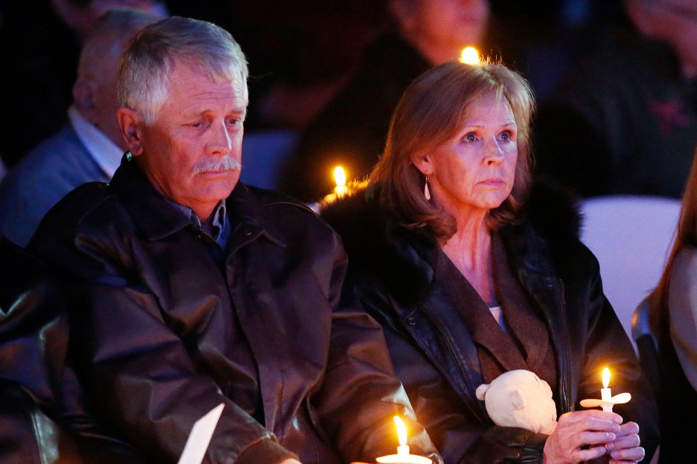 Carl, left, and Marsha Mueller hold candles at a memorial in honor of their daughter Kayla Mueller on Feb. 18, 2015, in Prescott, Ariz. (Photo by Rob Schumacher/The Arizona Republic/AP)