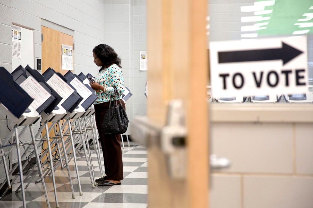 A voter casts her ballot at a polling site during early voting for Georgia's primary election in Atlanta on May, 16, 2014.