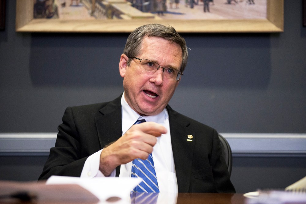 Sen. Mark Kirk, R-Ill., speaks with Roll Call at his desk in the Hart Senate Office Building on Nov. 13, 2014. (Photo By Bill Clark/CQ Roll Call/AP)