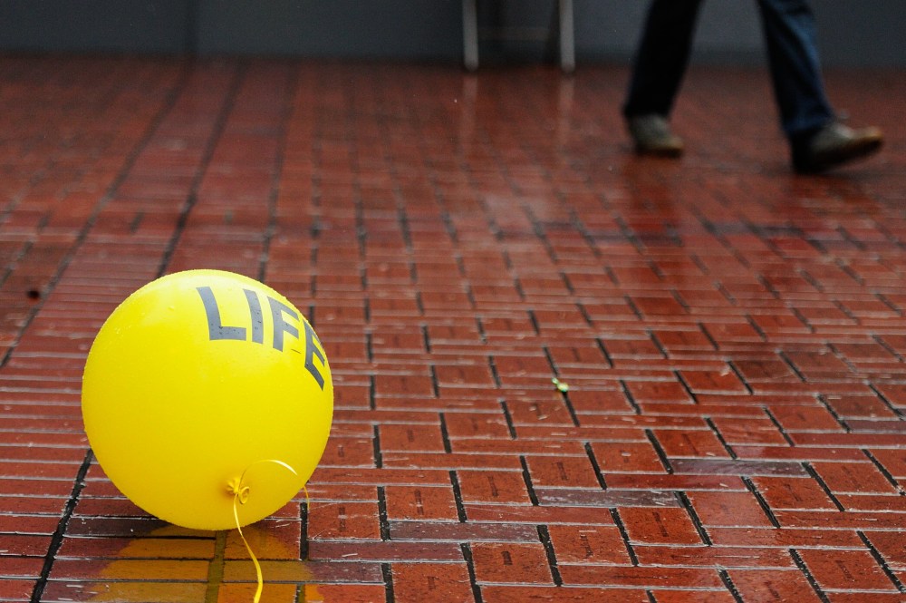 Anti-abortionists rally in Pioneer Courthouse Square in Portland, Ore., on Jan. 18, 2015, to protest against the 1973 Supreme Court decision, Roe v. Wade, that abolished state laws banning abortion. (Photo by Alex Milan Tracy/AP)