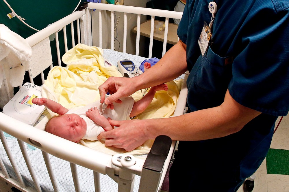 A nurse at East Tennessee Children's Hospital in Knoxville, Tenn., gives medication to Baby Liam, who was born dependent on drugs, Mar. 29, 2013.