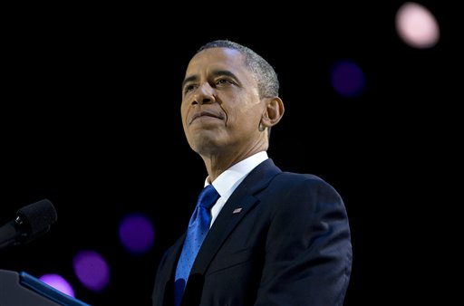 resident Barack Obama pauses as he speaks at the election night party at McCormick Place, Wednesday  in Chicago. Obama defeated Republican challenger former Massachusetts Gov. Mitt Romney. (AP Photo/Carolyn Kaster)