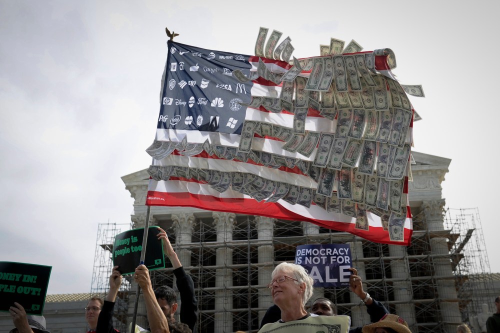 Demonstrators gather outside the Supreme Court in Washington on Oct. 8, 2013, as the court heard arguments on campaign finance. (Susan Walsh/AP)