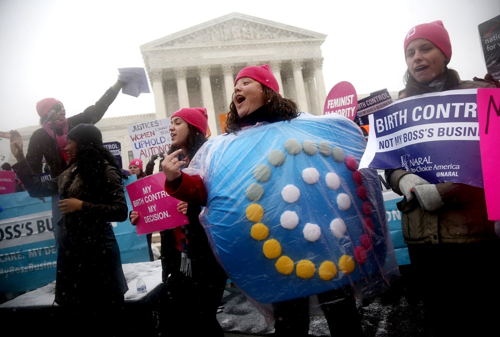 Margot Riphagen of New Orleans, La., wears a birth control pills costume as she protests in front of the Supreme Court in Washington, on March 25, 2014.