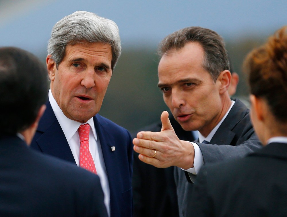 Jean-Luc Chopard, Geneva head of Protocol, right, welcomes US Secretary of State John Kerry, left, at his arrival for closed-door nuclear talks at the United Nations offices in Geneva, Switzerland, Friday, Nov. 8, 2013.