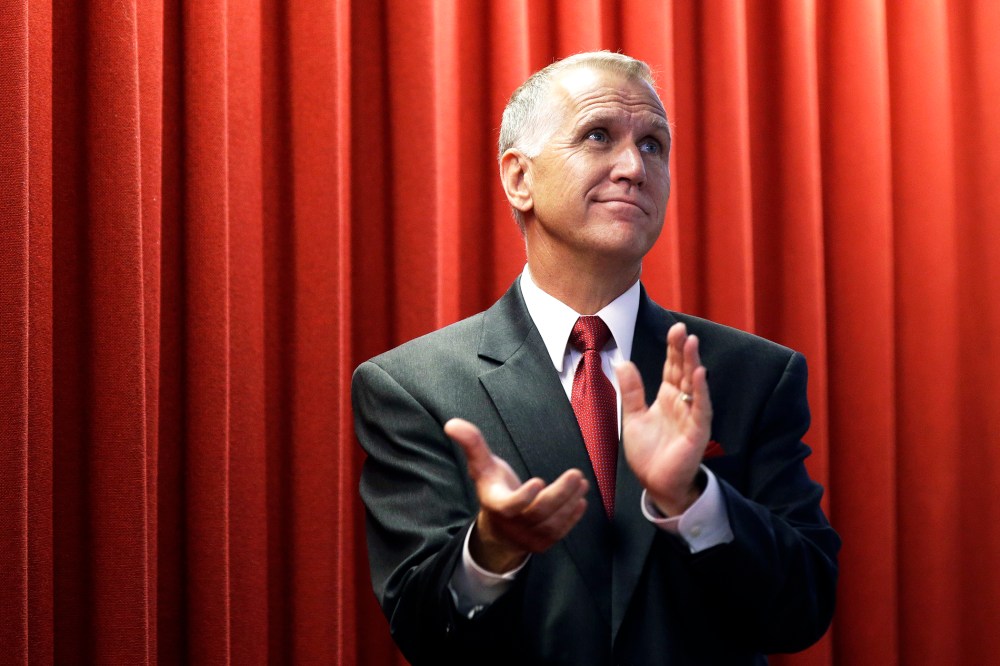House speaker Thom Tillis applauds guests in the gallery from the House floor during the opening session of the General Assembly in Raleigh, N.C., May 14, 2014. (Photo by AP)