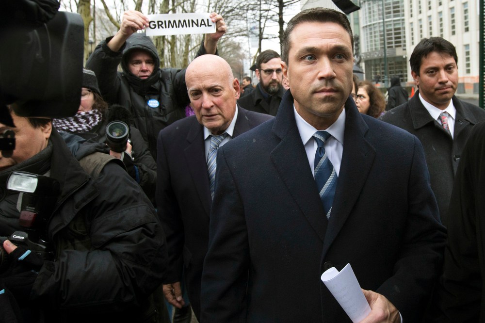 Rep. Michael Grimm leaves Federal court in Brooklyn after pleading guilty to a federal tax evasion charge rather than go to trial next month, Dec. 23, 2014, in New York. (Photo by John Minchillo/AP)