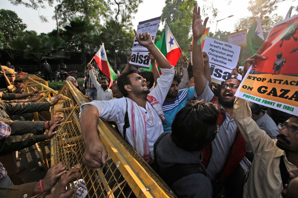 Protesters from various student unions shout slogans during a protest outside the Israeli Embassy in New Delhi, India, Monday, Nov. 19, 2012. The protest was against the Israeli military operations in Gaza Strip. (AP Photo/Manish Swarup)