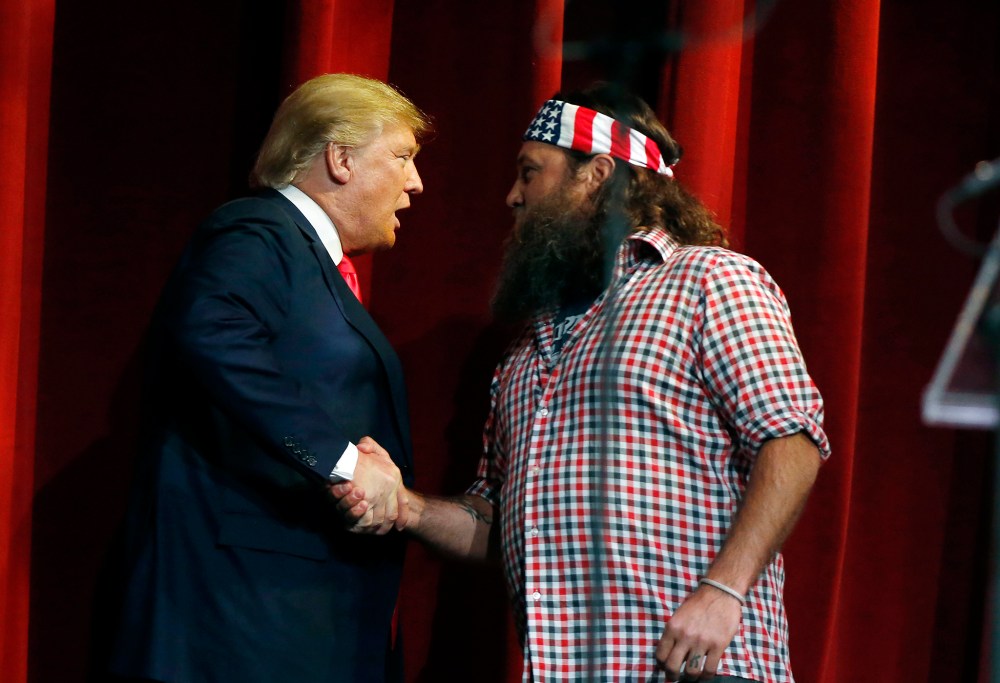 Willie Robertson welcomes Republican presidential candidate Donald Trump to the stage during the Outdoor Channel and Sportsman Channel's 16th annual Outdoor Sportsman Awards, Jan. 21, 2016, in Las Vegas. (Photo by Isaac Brekken/AP)