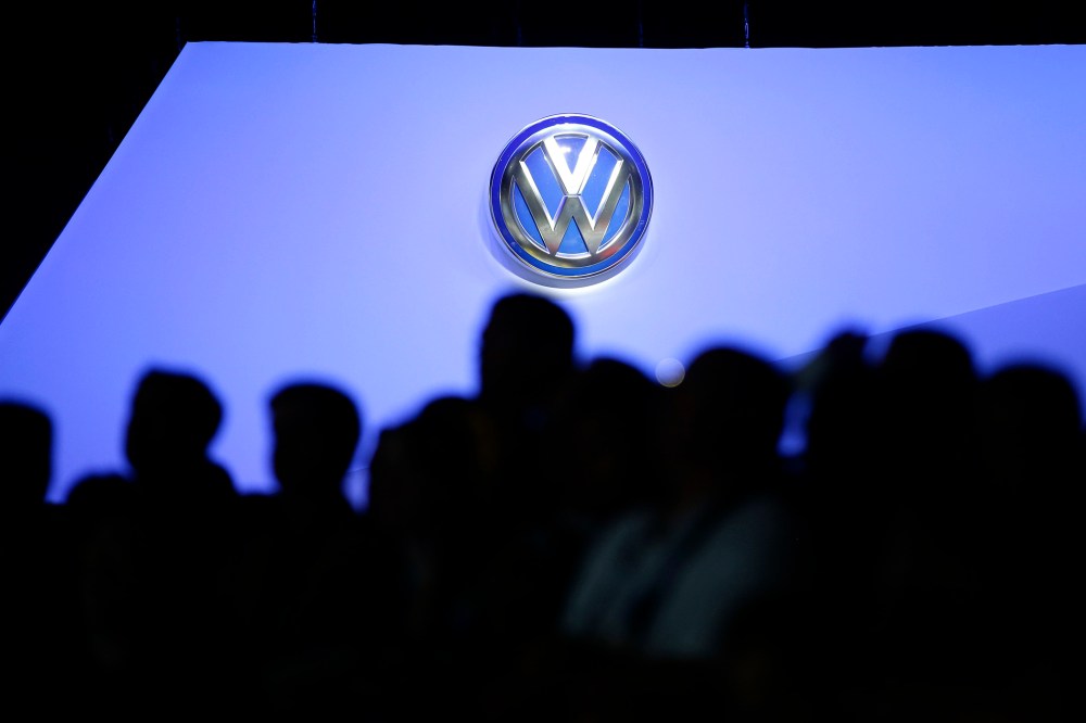 The Volkswagen logo is displayed as people gather at the Los Angeles Auto Show, Nov. 20, 2013, in Los Angeles, Calif. (Photo by Jae C. Hong/AP)