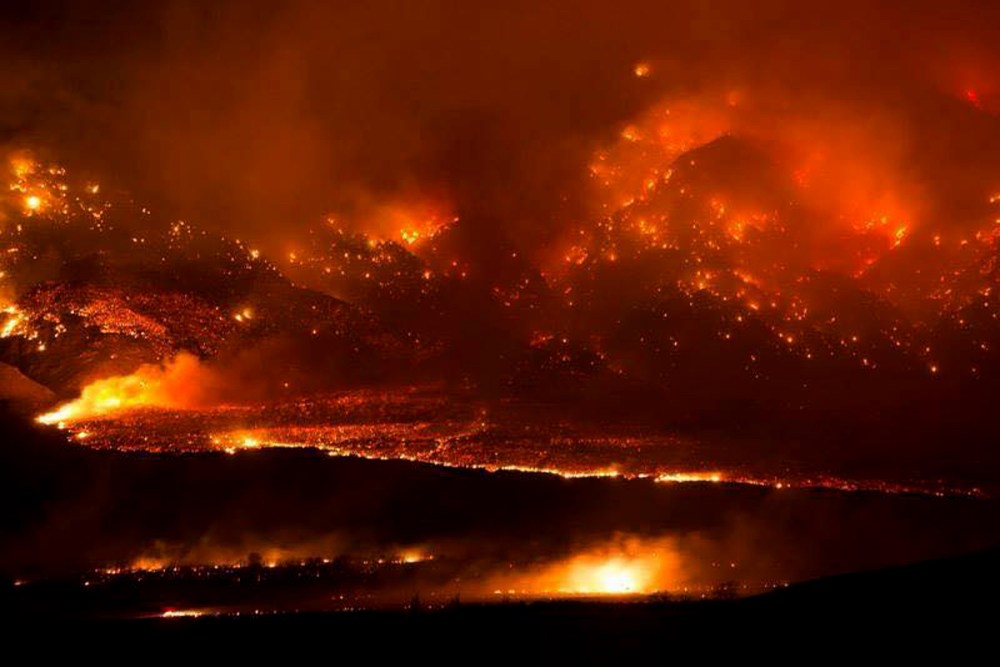 The Round fire burning at Wheeler Crest near Bishop Calif. Friday Feb. 6, 2015. The wildfire has destroyed 40 homes and forced about 150 people to leave two small California towns at the eastern base of the Sierra Nevada. (Photo by Jim Stimson/CalFire/AP)