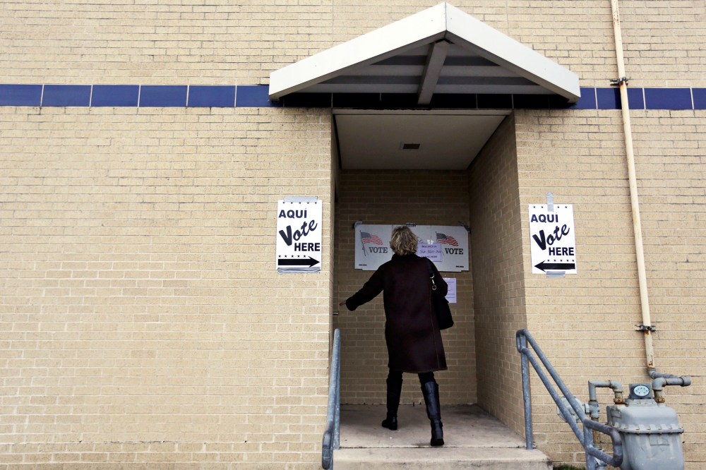 A voter arrives at a polling site, Tuesday, March 4, 2014, in San Antonio.