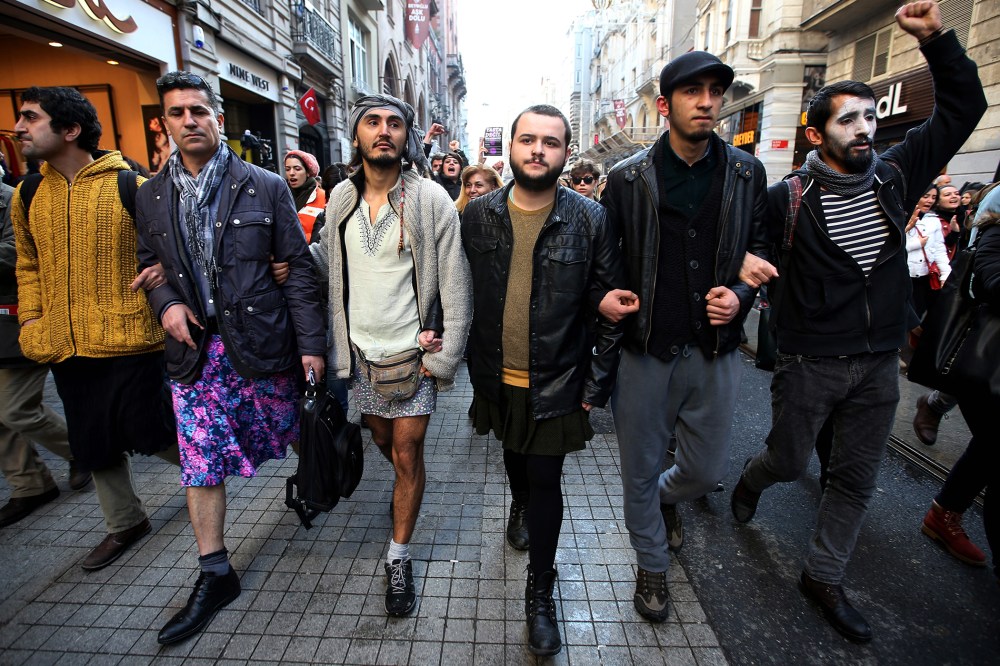 Men wear skirts to show solidarity with women who have been protesting against violence against women since the recent murder of Ozgecan Aslan, a 20-year-old woman, in Istanbul, Turkey, on Feb. 21, 2015. (Photo by Emrah Gurel/AP)