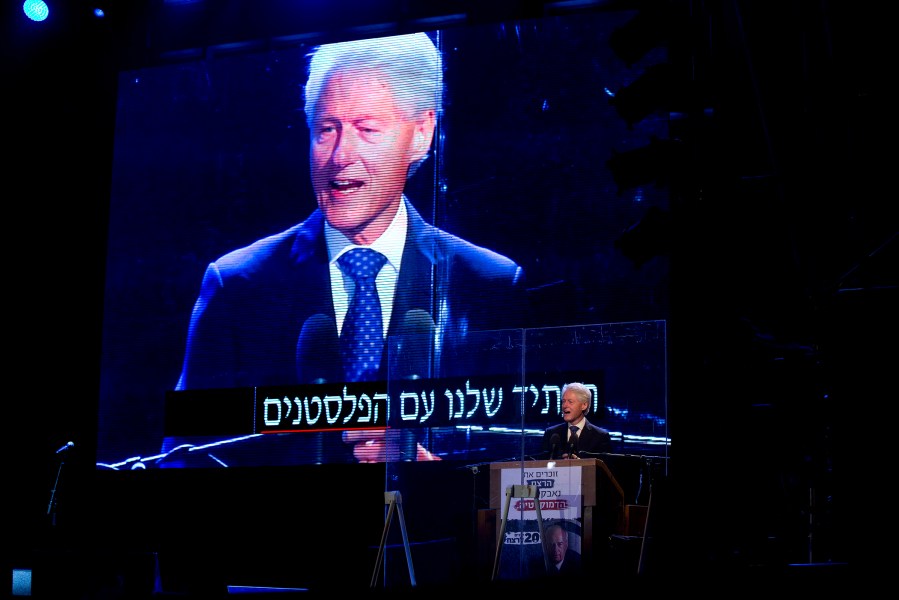 Former US President Bill Clinton speaks during a rally marking 20 years since the assassination of the late Israeli Prime Minister Yitzhak Rabin, Oct. 31, 2015 in Tel Aviv, Israel. (Photo by Oded Balilty/AP)