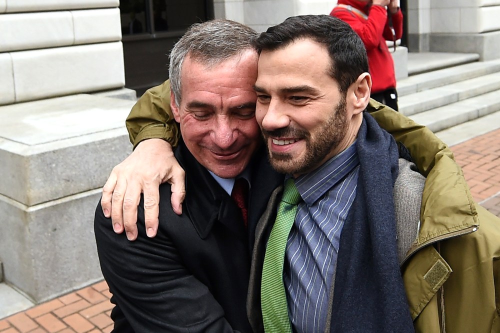 Louisiana plaintiffs, Havard Scott, left, and Sergio March embrace outside of the 5th U.S. Circuit Court of Appeals, Jan. 9, 2015, in New Orleans, La. (Photo by Stacy Revere/AP)