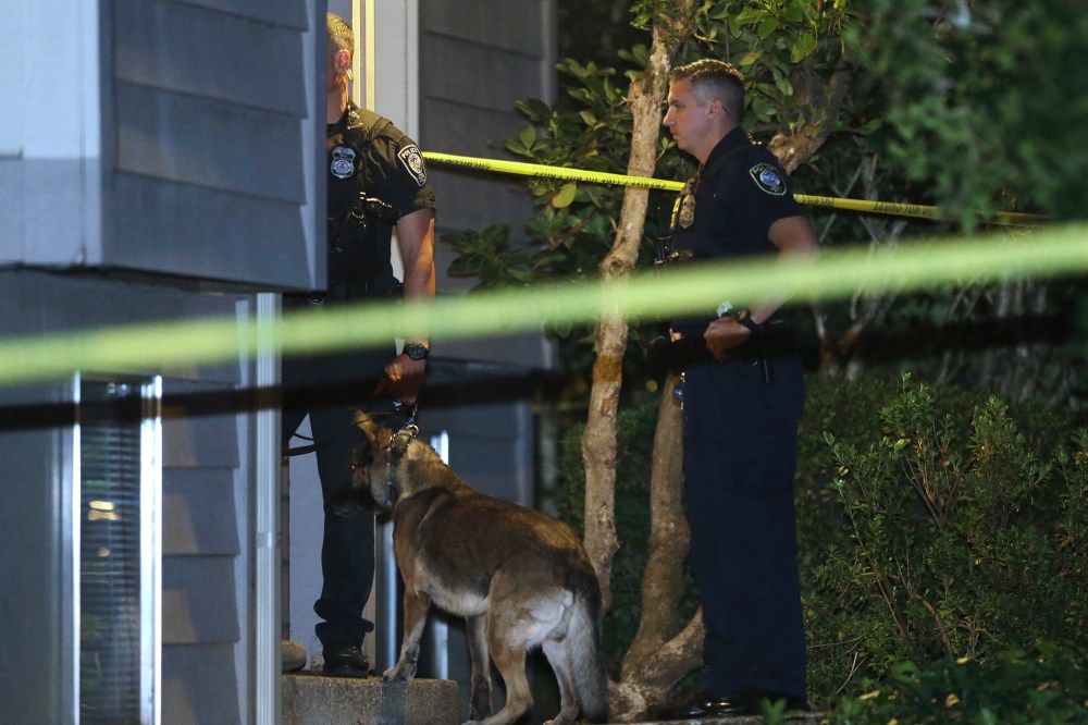 Law enforcement officers investigate a home in Roseburg, Ore., Oct. 1, 2015. A gunman opened fire inside a classroom at Umpqua Community College before dying in a shootout with police. (Photo by Rich Pedroncelli/AP)
