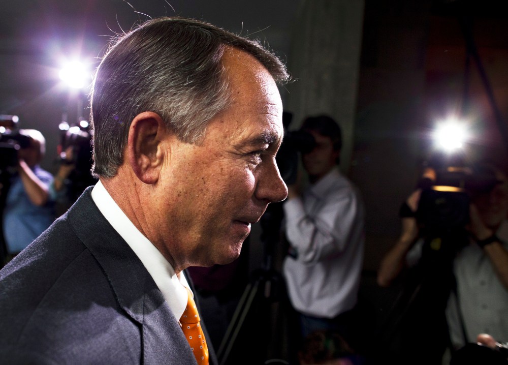 Speaker of the House John Boehner walks past reporters after a meeting with House Republicans on Capitol Hill on Wednesday, Oct. 16, 2013 in Washington.