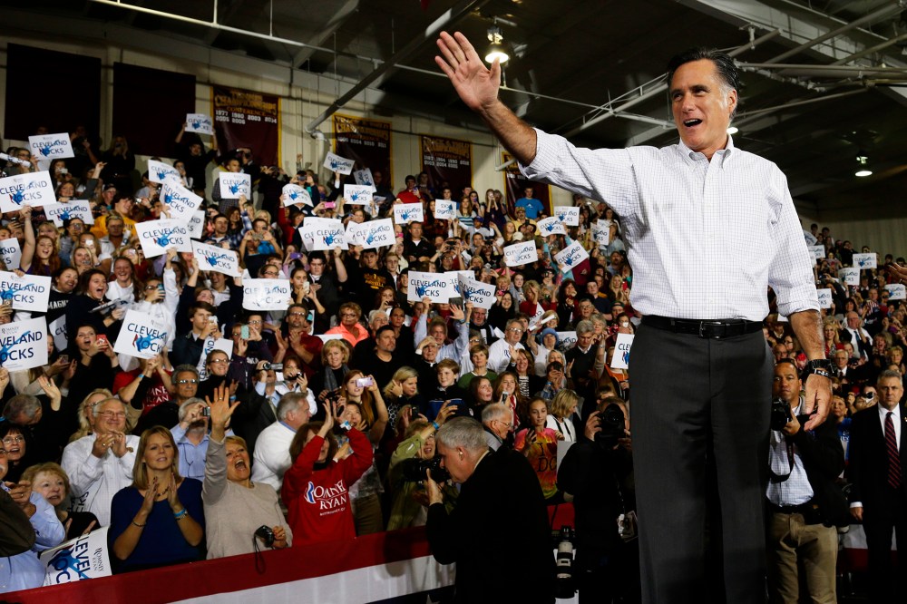 Republican presidential candidate, former Massachusetts Gov. Mitt Romney waves to supporters as he takes the stage at a campaign stop at Avon Lake High School in Avon Lake, Ohio, Oct. 29, 2012.