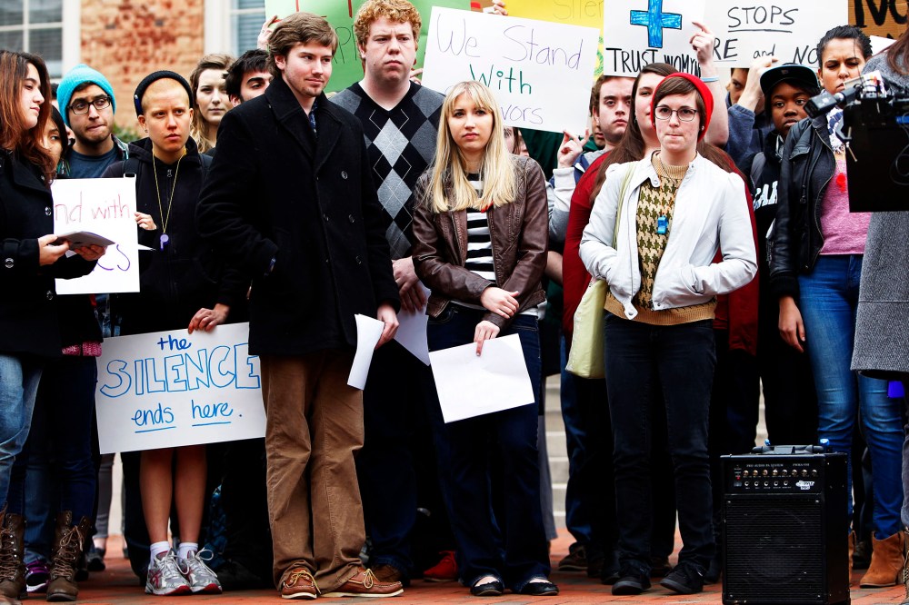 UNC-Chapel Hill students stand during a rally Friday March 1, 2013.