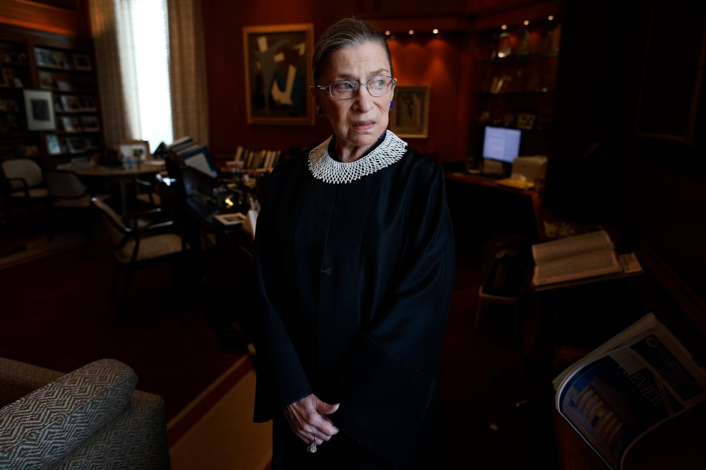 Associate Justice Ruth Bader Ginsburg poses for a photo in her chambers at the Supreme Court in Washington, on July 24, 2013,