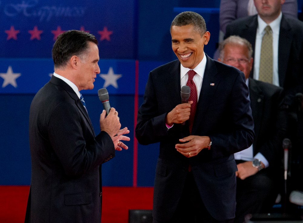 President Barack Obama and Republican presidential candidate, former Massachusetts Gov. Mitt Romney, participate in the presidential debate, Tuesday, Oct. 16, 2012, at Hofstra University in Hempstead, N.Y. (AP Photo/Carolyn Kaster)