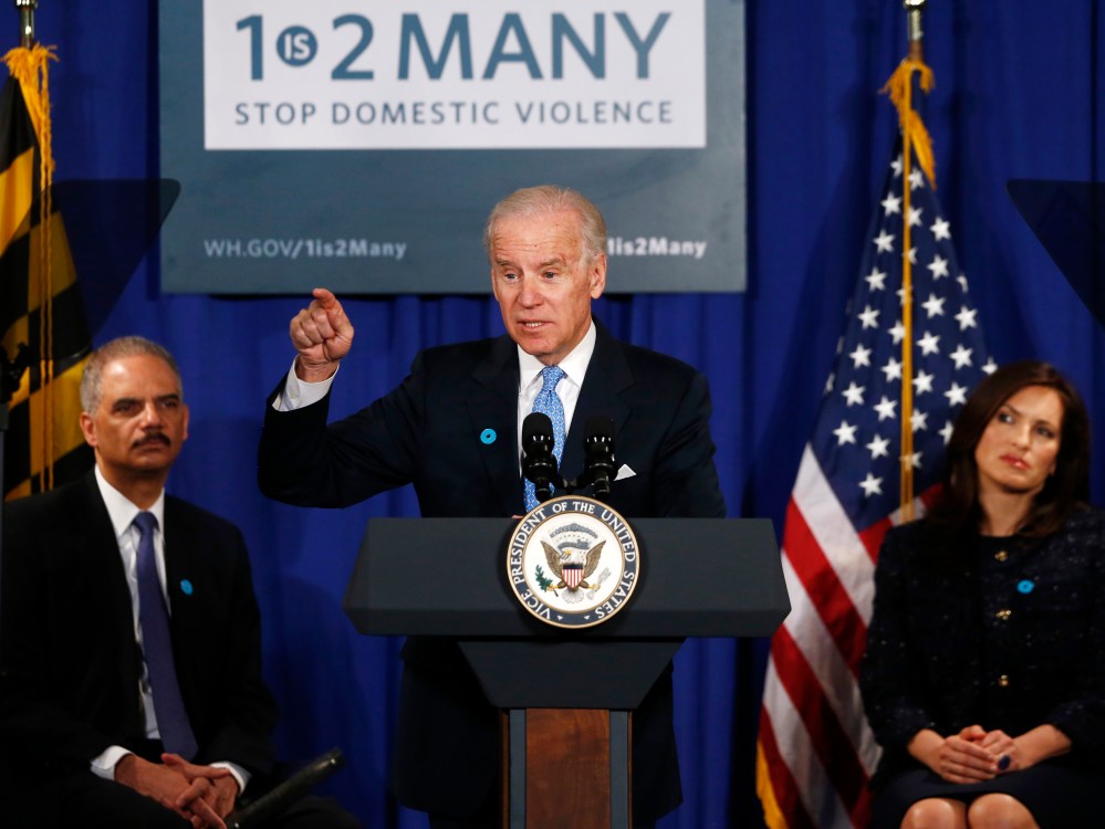 Vice President Joe Biden, flanked by Attorney General Eric Holder, left, and actress Mariska Hargitay, gestures as he speaks about reducing domestic violence, Wednesday, March 13, 2013, at the Montgomery County Executive Office Building in Rockville,...