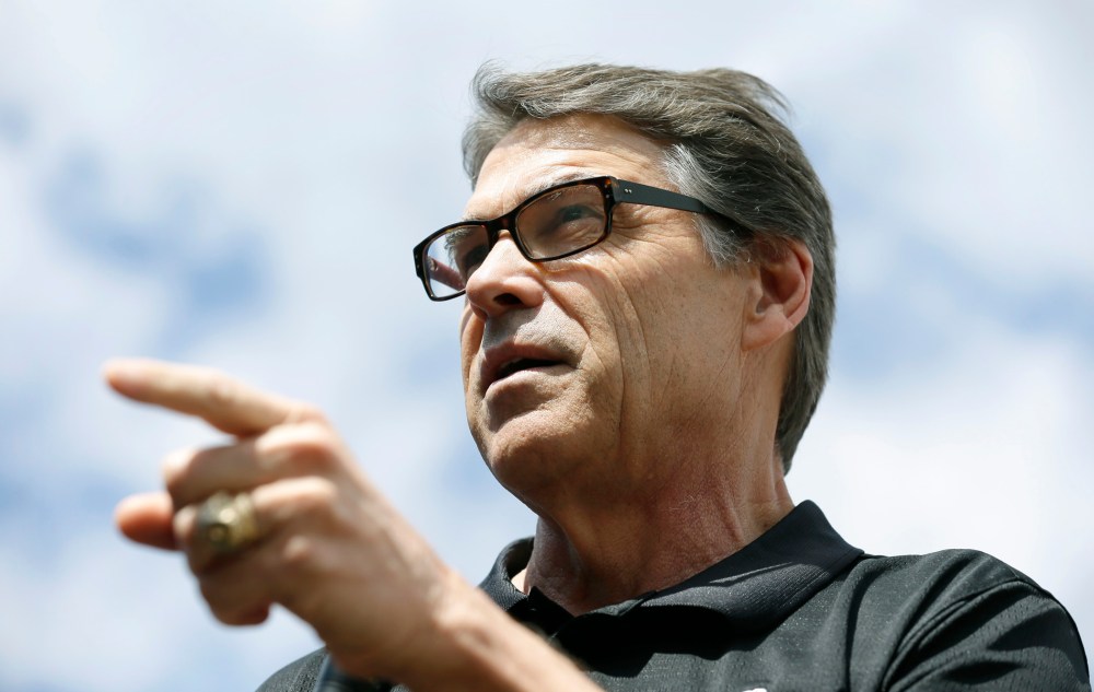 Texas Gov. Rick Perry speaks at the Des Moines Register's Political Soapbox at the Iowa State Fair, Tuesday, Aug. 12, 2014, in Des Moines, Iowa.