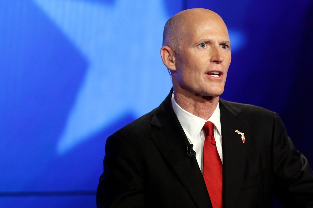 Florida Republican Gov. Rick Scott responds to a question during a gubernatorial debate against Democrat Charlie Crist on Oct. 10, 2014, in Miramar, Fla. (Photo by Lynne Sladky/AP)