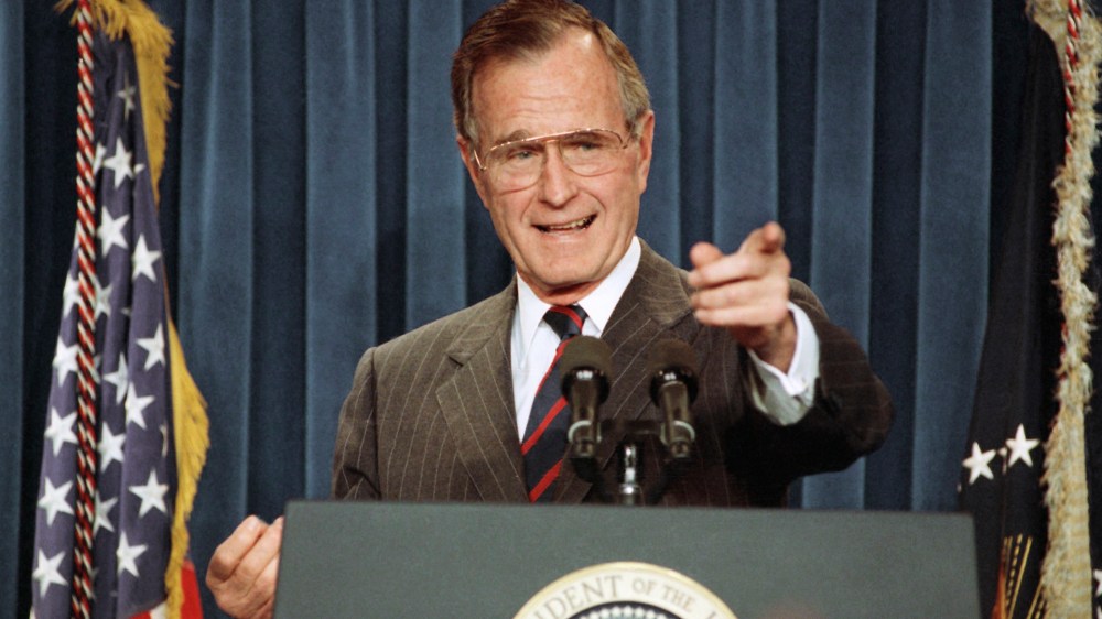 President George H.W. Bush acknowledges a reporter during a news conference at the White House on Dec. 5, 1991. (Photo by Greg Gibson/AP)