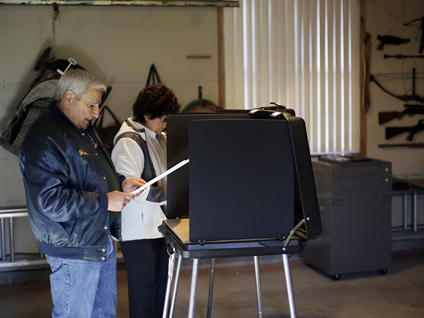 Gene Dovin, left, and his wife Bea Dovin, both of Forest City casts their votes at a polling place inside a residential garage, Tuesday, Nov. 6, 2012, in Forest City, Pa. (Photo by Matt Slocum/AP)