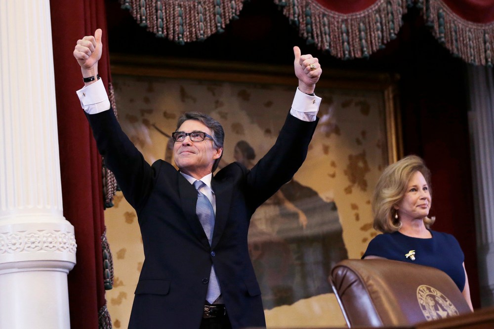 Texas Gov. Rick Perry, left, acknowledges applause next to his wife, Anita, before giving a farewell speech to a joint session of the Texas Legislature, Jan. 15, 2015, in Austin, Texas. (Photo by Eric Gay/AP)
