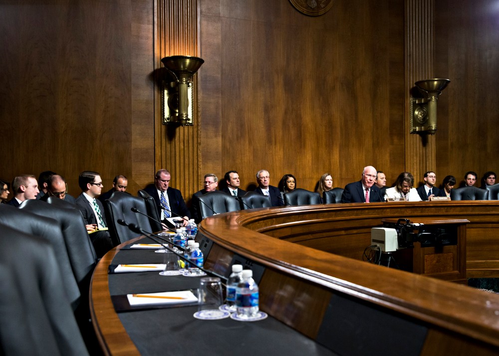 Sen. Patrick Leahy expresses frustration as the seats on the Republican side of the Senate panel remain empty, causing the cancellation of a meeting to consider President Barack Obama's judicial nominations, Nov. 21, 2013.