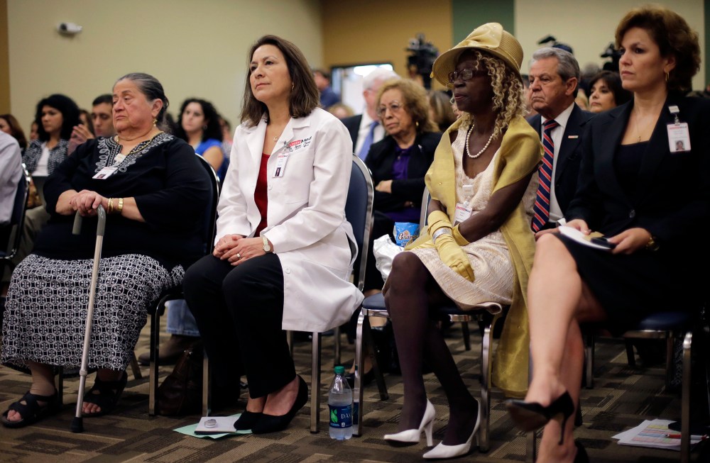 Audience members listen to Health and Human Services Secretary Kathleen Sebelius