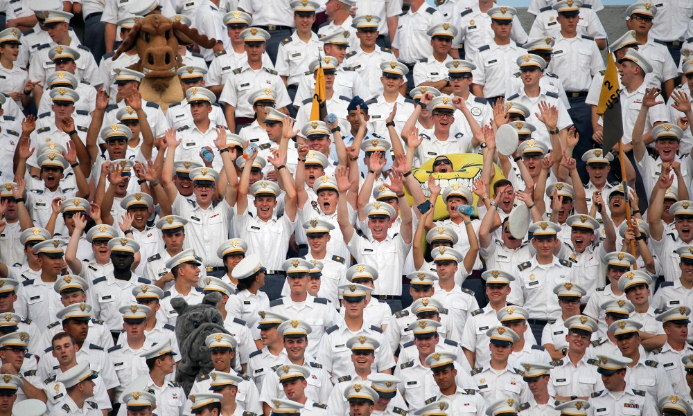 Cadets cheer during the first half of an NCAA college football game between Army and Fordham in West Point, N.Y. More than a dozen students were injured during the annual pillow fight by first year cadets on Aug. 20, 2015. (Photo by Mike Groll/AP)