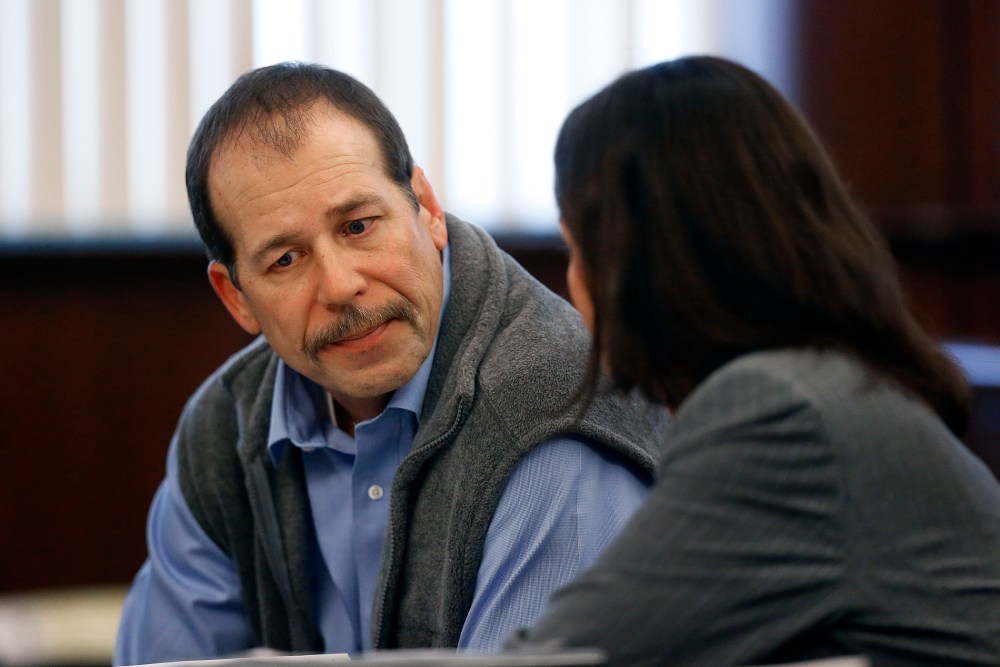 Theodore Wafer listens to his attorney Cheryl Carpenter while appearing at his preliminary examination before District Court Judge David Turfe in Dearborn Heights, Mich., Dec. 18, 2013.