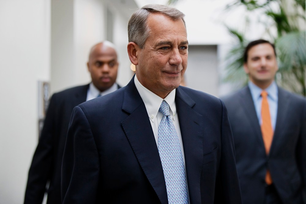 John Boehner smiles as walks to a strategy meeting with fellow Republicans, Feb. 4, 2014.