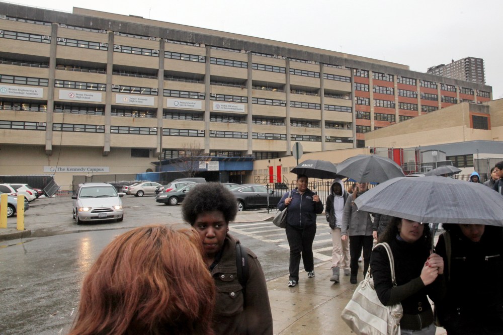 Students leave the John F. Kennedy multi-high school campus during afternoon showers in the Bronx, N.Y. on March 12, 2010. (Photo by Bebeto Matthews/AP)
