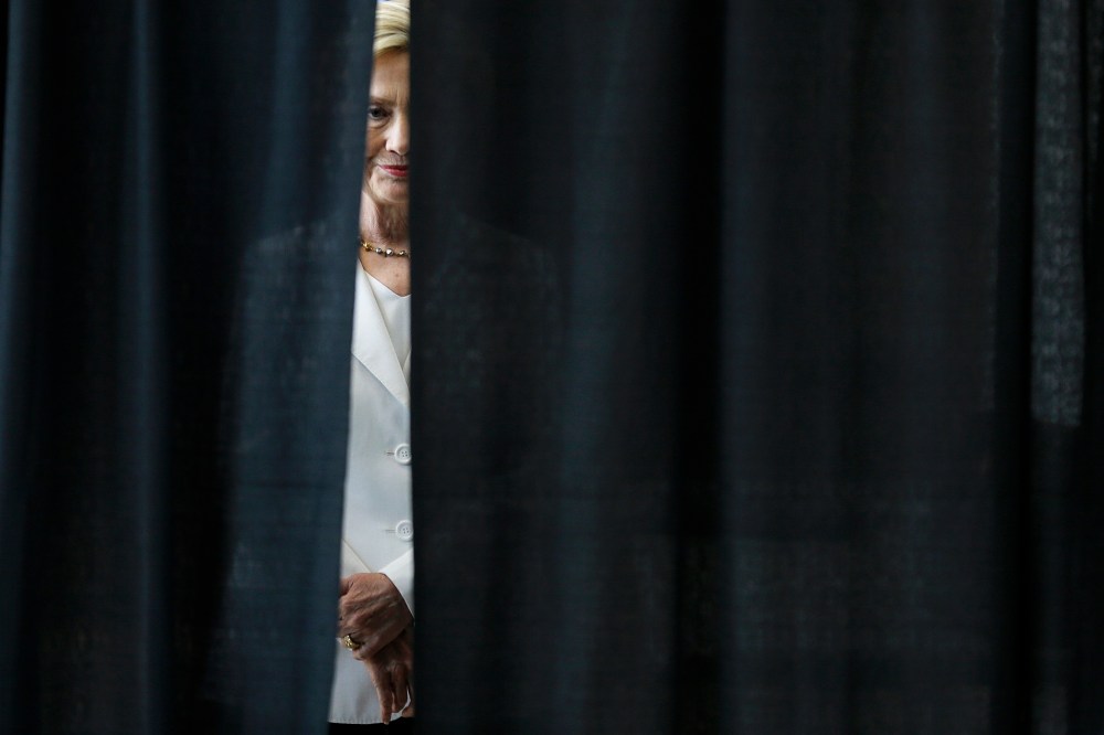 Democratic presidential candidate Hillary Rodham Clinton waits to be introduced before speaking about rural issues at the Des Moines Area Community College, Aug. 26, 2015, in Ankeny, Iowa. (Photo by Charlie Neibergall/AP)