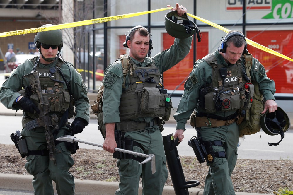 Richmond SWAT team members leave a Greyhound bus station, March 31, 2016 in Richmond, Va. (Photo by Steve Helber/AP)