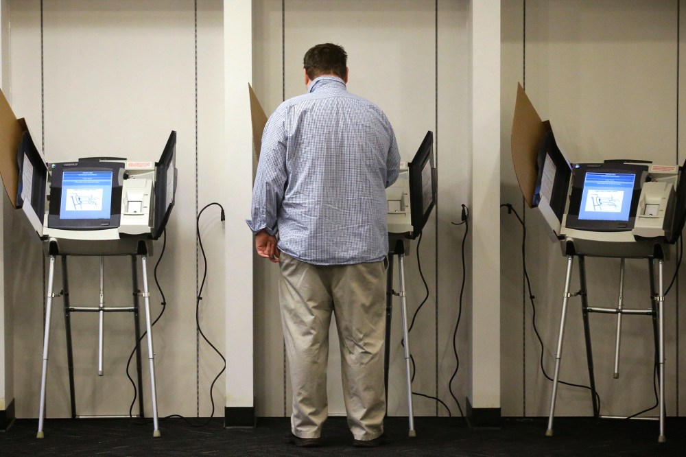 A man votes  in Salt Lake City, Utah. (Photo by Rick Bowmer/AP)