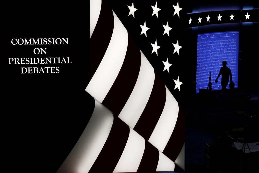 Workers prepare the debate site ahead of the second presidential debate at Washington University, Oct. 7, 2016, in St. Louis, Mo. (Photo by John Locher/AP)
