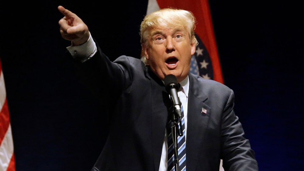 Republican presidential candidate Donald Trump yells at a protester during a campaign rally, March 11, 2016, in St. Louis. (Photo by Seth Perlman/AP)