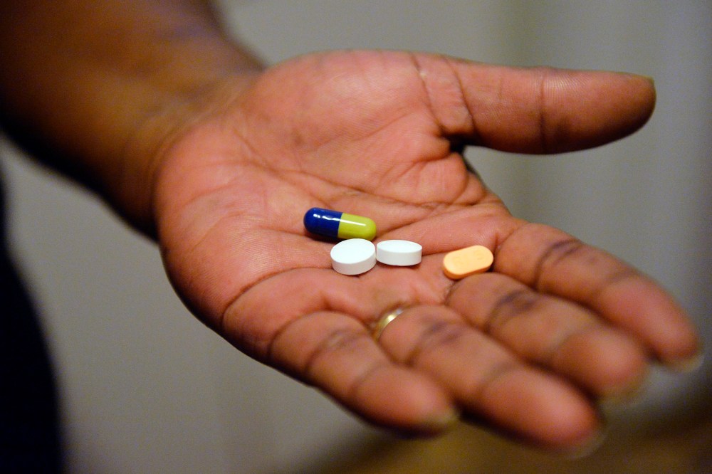 In this Friday, Jan. 8, 2016 photo, a woman shows just a few of the pills that she takes daily to alleviate her anxiety, while at her York home, Pa. (Photo by Chris Dunn/York Daily Record/AP)