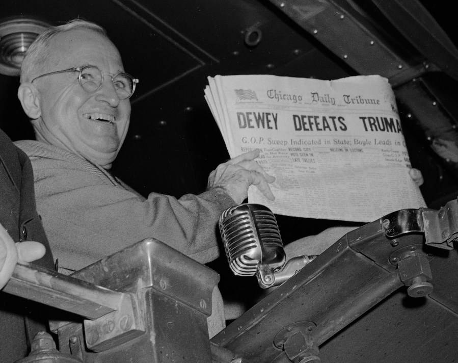 U.S. President Harry S. Truman holds up an Election Day edition of the Chicago Daily Tribune, which, based on early results, mistakenly announced 